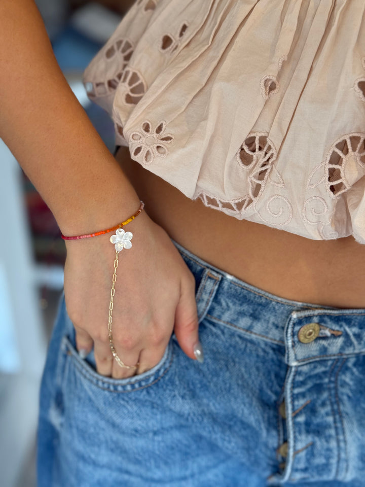 Lara L petal  glow hand chain
