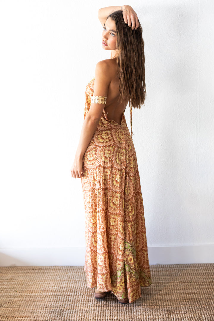 woman wearing gold arm cuff